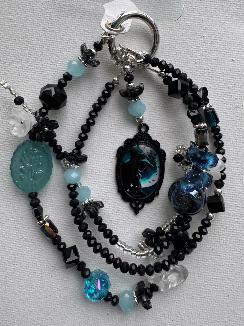Multi-Strand Black and Teal Beaded Necklace with Blue Accent Witches Pendant